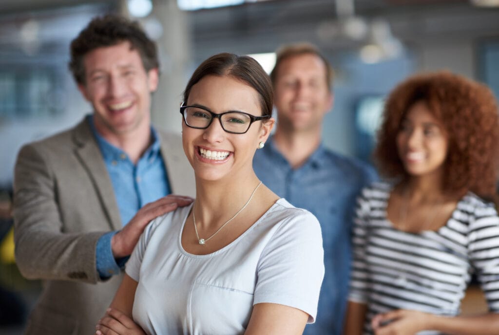female leader confident team diversity portrait office support solidarity teamwork woman group hand shoulder motivation coworking assistance workplace